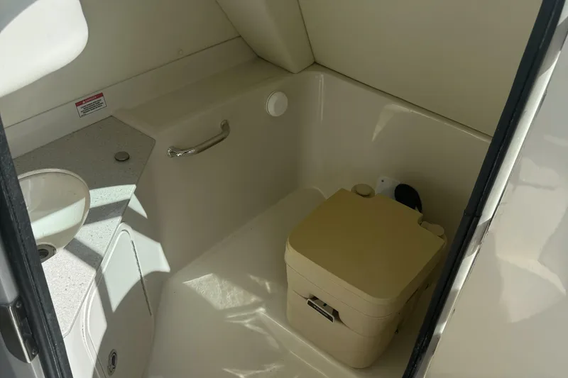 Slide: The Image of 2008 Sea Ray 290 Sundeck boat interior with compact bathroom amenities. - 12