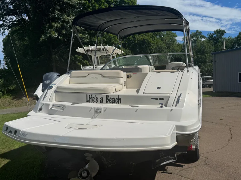 Slide: The Image of 2008 Sea Ray 290 Sundeck boat with "Life's a Beach" text on the back. - 2
