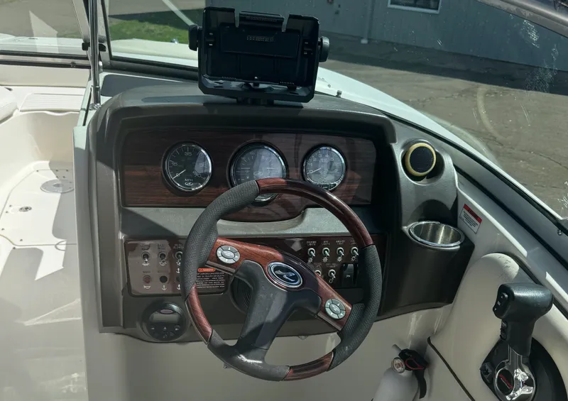 Slide: The Image of 2008 Sea Ray 290 Sundeck dashboard with steering wheel and instrument panel. - 7