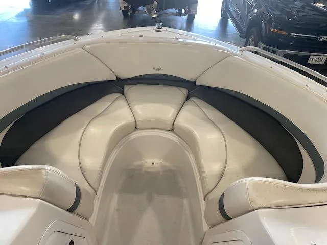 Slide: The Image of Interior view of 2000 Four Winns 210 Horizon boat with cushioned seating. - 12