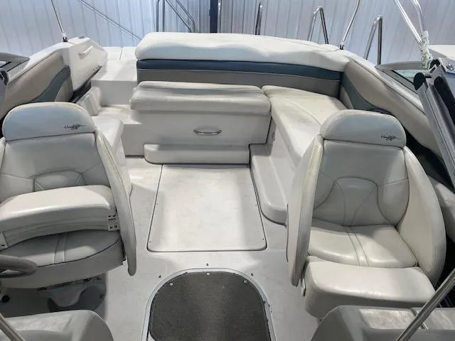Slide: The Image of 2000 Four Winns 210 Horizon boat interior with white seating and spacious layout. - 13