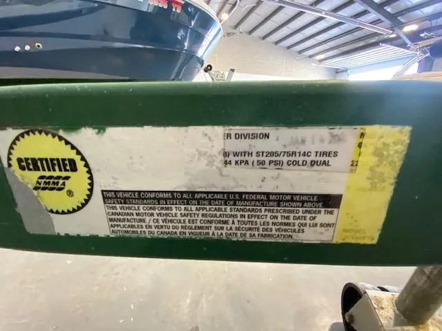 Slide: The Image of Sticker on a 2000 Four Winns 210 Horizon boat trailer, showing certification details. - 3