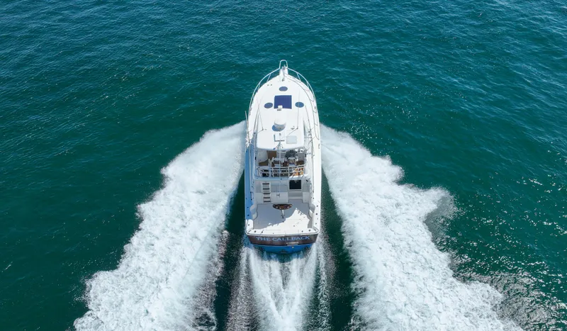 Slide: The Image of Riviera 42 Flybridge 2007 cruising on open water, aerial view. - 13