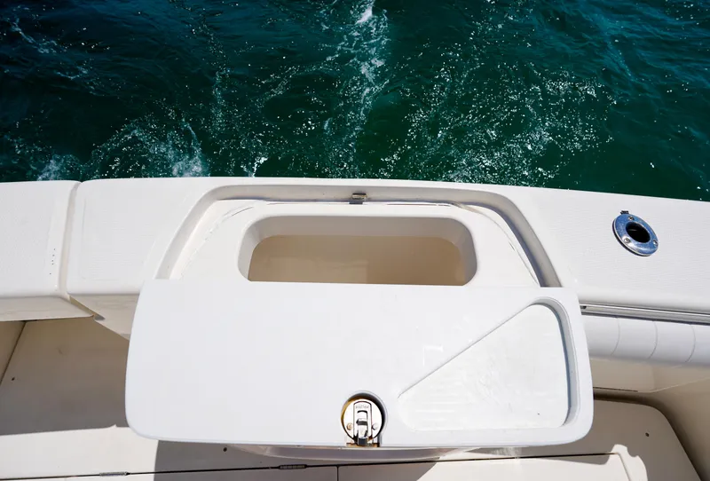 Slide: The Image of Riviera 42 Flybridge 2007 boat deck with open storage compartment, ocean view. - 25