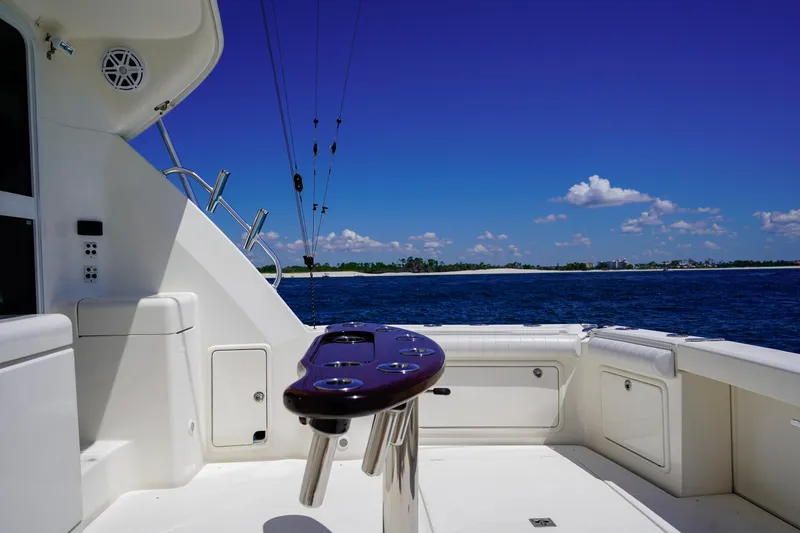 Slide: The Image of 2007 Riviera 42 Flybridge yacht deck with ocean view and clear blue sky. - 27