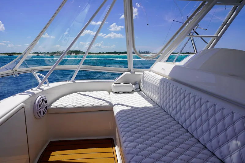 Slide: The Image of Luxurious 2007 Riviera 42 Flybridge yacht interior with ocean view and plush seating. - 35