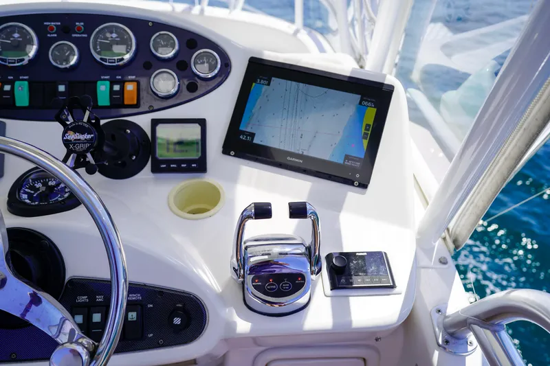 Slide: The Image of Control panel of 2007 Riviera 42 Flybridge with navigation screen and steering wheel. - 40
