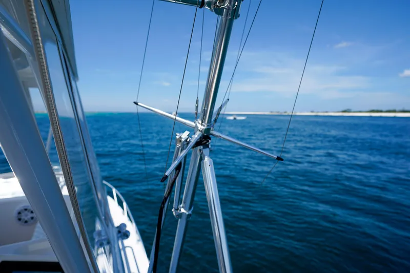 Slide: The Image of Riviera 42 Flybridge yacht on open sea, showcasing sleek design and clear blue waters. - 45