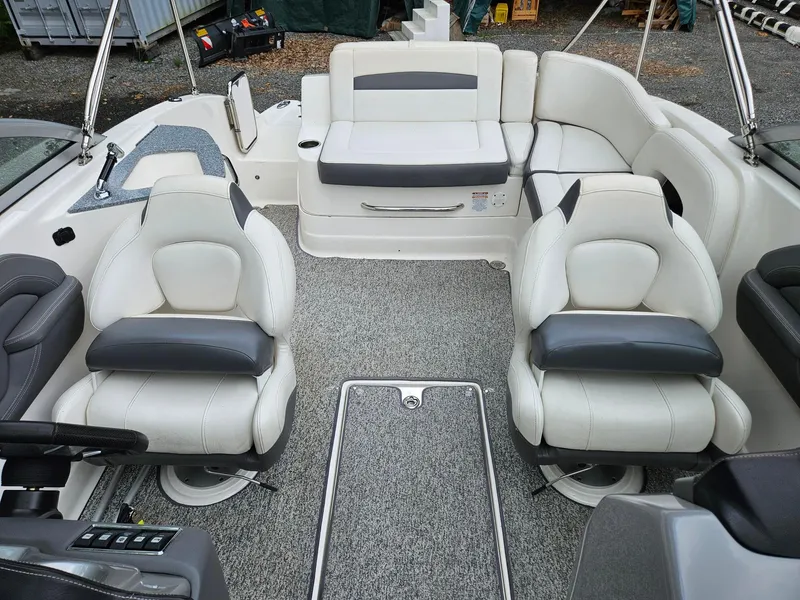 Slide: The Image of 2014 Chaparral 224 Sunesta boat interior with white and gray seating arrangement. - 10