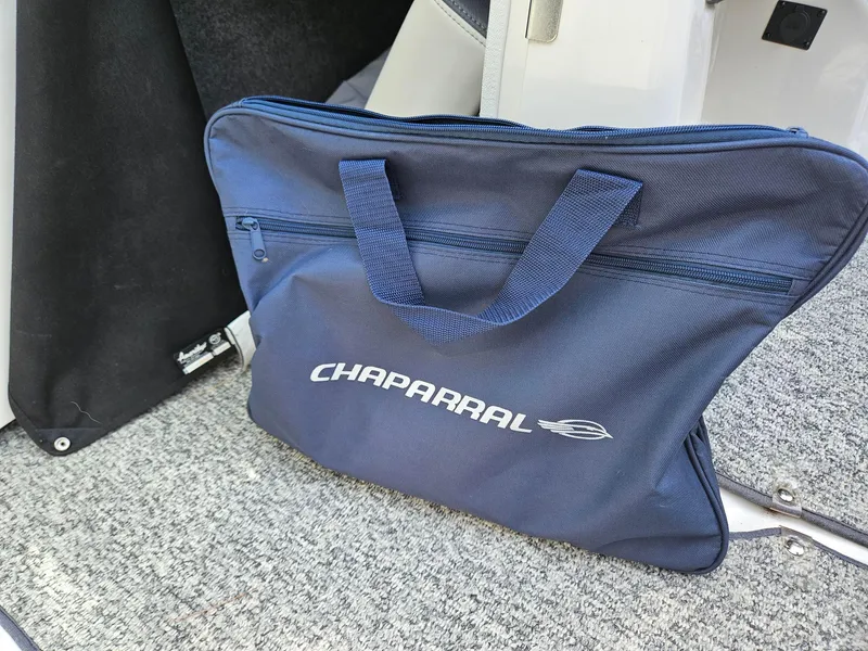 Slide: The Image of Blue Chaparral bag on carpeted floor of 2014 Chaparral 224 Sunesta boat. - 21