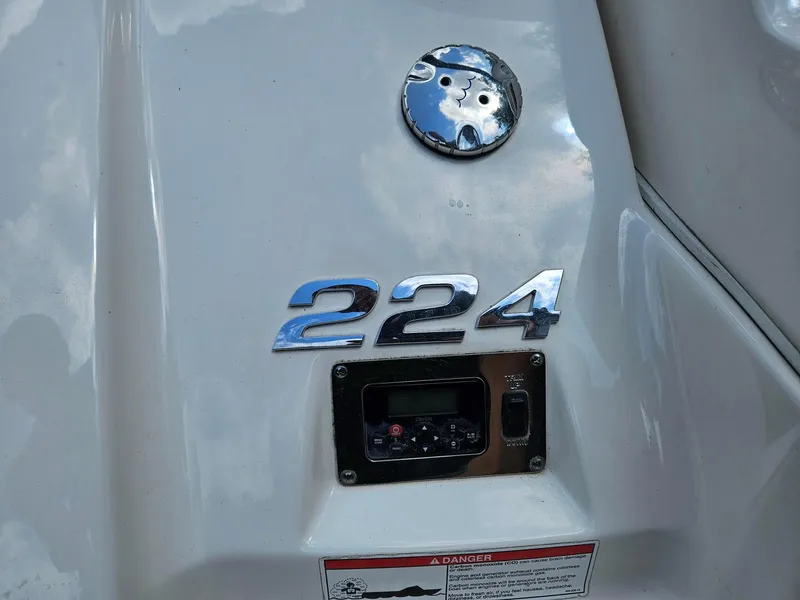 Slide: The Image of 2014 Chaparral 224 Sunesta boat dashboard with control panel and model number. - 27