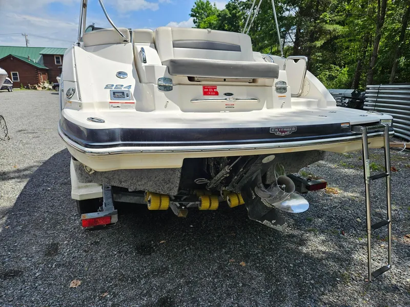 Slide: The Image of 2014 Chaparral 224 Sunesta boat rear view with ladder and propeller. - 4