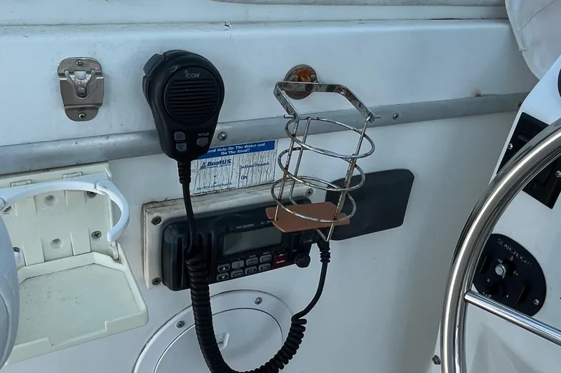 Slide: The Image of Control panel of a 1976 Uniflite 28 Salty Dog boat with radio and steering wheel. - 10