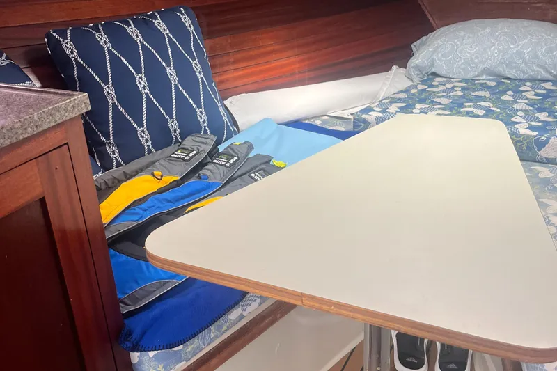 Slide: The Image of Interior of 1976 Uniflite 28 Salty Dog with cushions and table. - 22