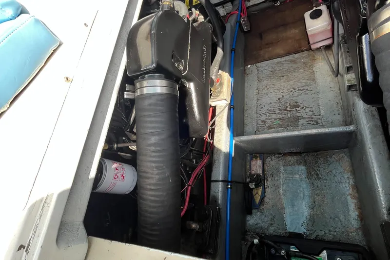 Slide: The Image of 1976 Uniflite 28 Salty Dog engine compartment with visible components and wiring. - 30