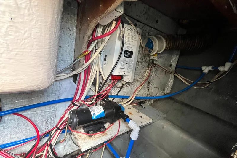 Slide: The Image of Electrical wiring and components inside a 1976 Uniflite 28 Salty Dog boat. - 35