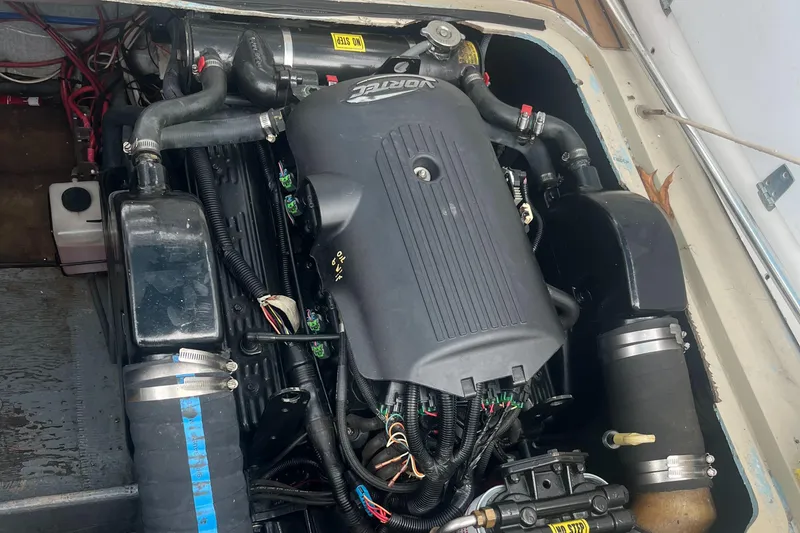 Slide: The Image of Engine compartment of a 1976 Uniflite 28 Salty Dog boat, showcasing detailed components. - 37