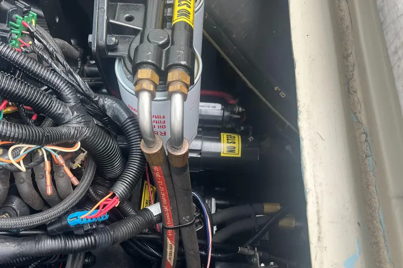 Slide: The Image of Engine compartment of a 1976 Uniflite 28 Salty Dog boat, showing wiring and components. - 38