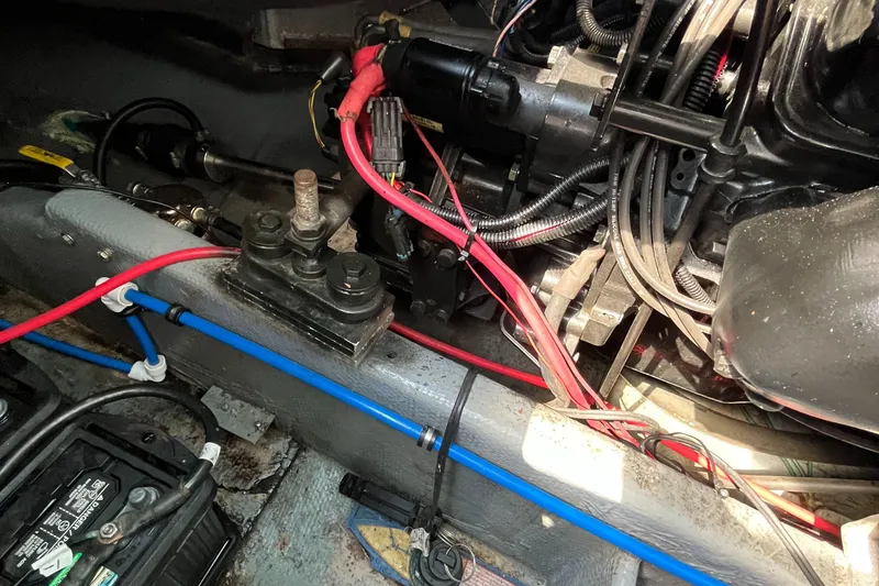 Slide: The Image of Engine compartment of a 1976 Uniflite 28 Salty Dog boat, showing wiring and components. - 42