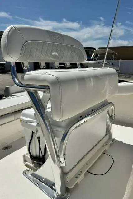 Slide: The Image of 2026 Key West 179 FS boat seat with white upholstery and chrome accents. - 11