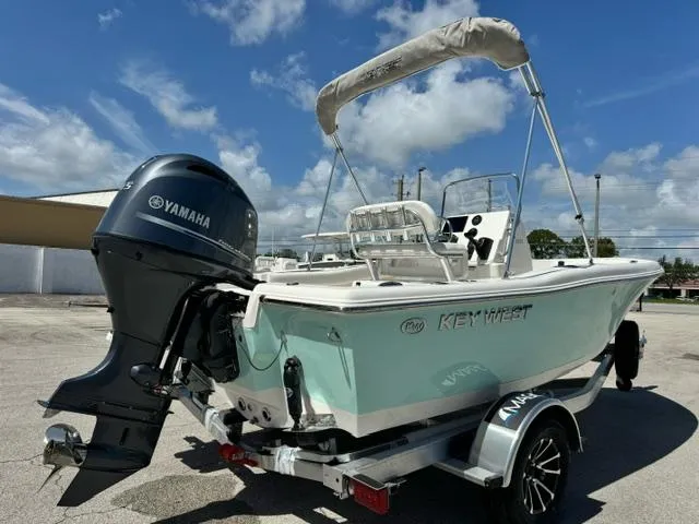 Slide: The Image of 2026 Key West 179 FS boat with Yamaha engine on trailer, parked outdoors. - 4