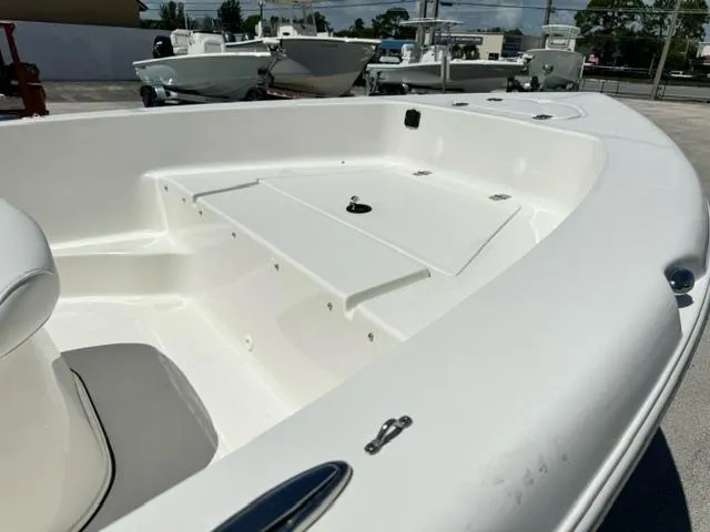 Slide: The Image of 2026 Key West 179 FS boat deck, white interior, spacious seating, modern design. - 8