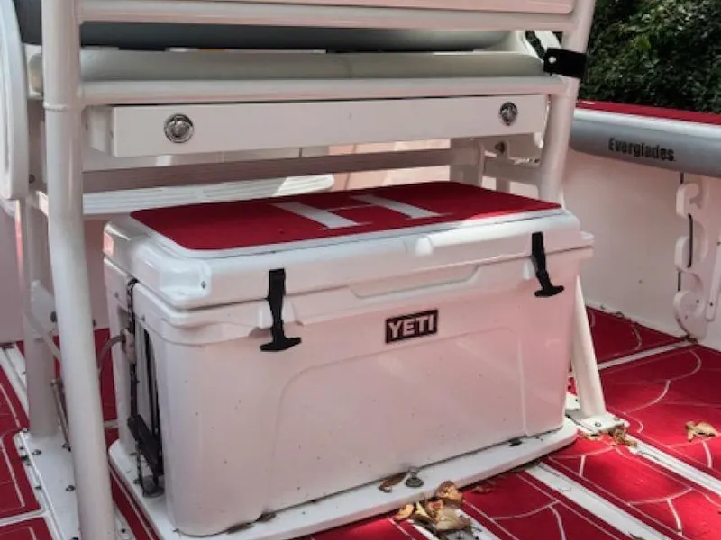 Slide: The Image of YETI cooler on 2018 Everglades 243CC boat with red flooring. - 11