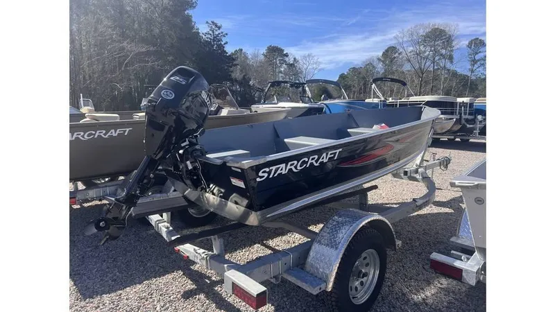 Slide: The Image of 2023 Starcraft SEAFARER 14 TL boat on trailer, outdoors, sunny day. - 2