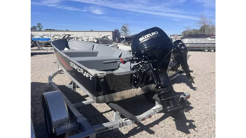 Slide: The Image of 2023 Starcraft SEAFARER 14 TL boat with Suzuki motor on trailer, outdoor display. - 4