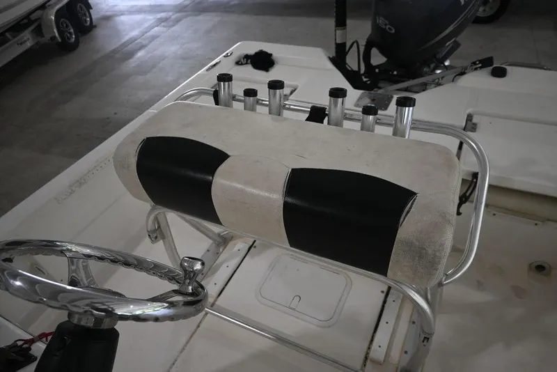 Slide: The Image of 2012 Skeeter ZX20 BAY boat console with steering wheel and rod holders. - 13