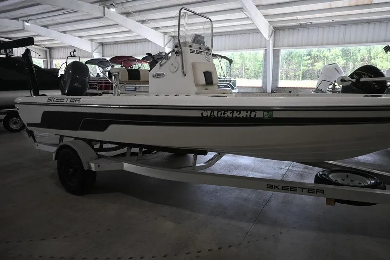 Slide: The Image of 2012 Skeeter ZX20 BAY boat on trailer in indoor storage facility. - 5