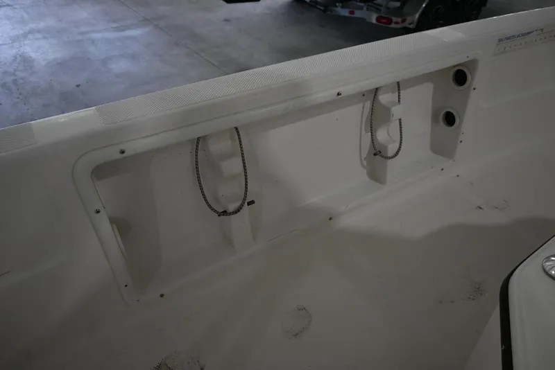 Slide: The Image of 2012 Skeeter ZX20 BAY boat interior with storage compartment and chain details. - 6