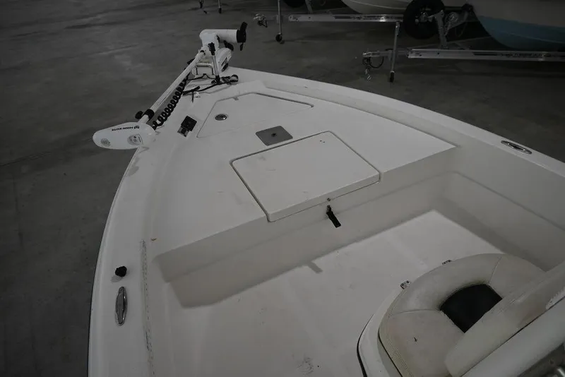 Slide: The Image of 2012 Skeeter ZX20 BAY boat interior with storage compartment and trolling motor. - 8