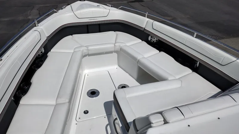 Slide: The Image of 2020 Formula 350 CBR boat interior with white seating and cup holders. - 10