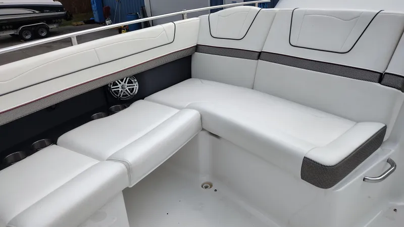 Slide: The Image of 2020 Formula 350 CBR boat interior with white cushioned seating and speaker. - 14