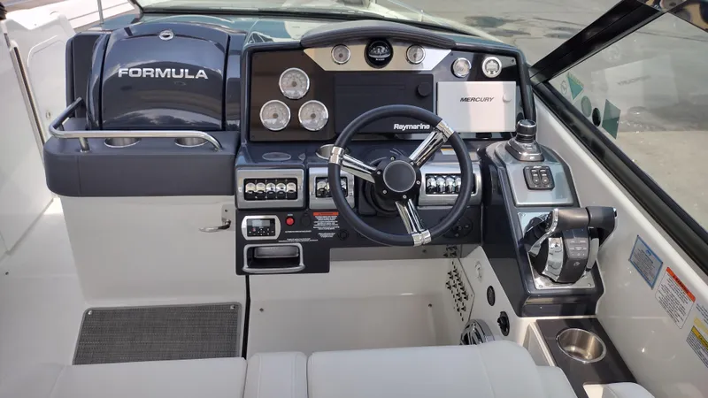 Slide: The Image of 2020 Formula 350 CBR boat dashboard with steering wheel and control panel. - 15