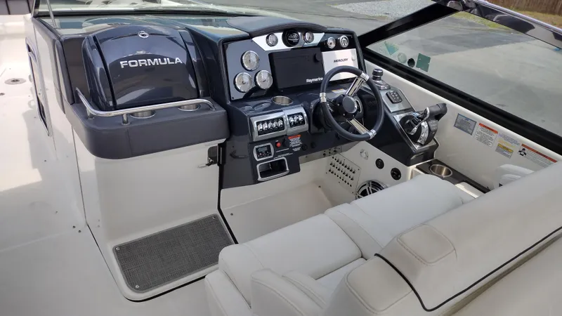 Slide: The Image of 2020 Formula 350 CBR boat cockpit with modern controls and steering wheel. - 16