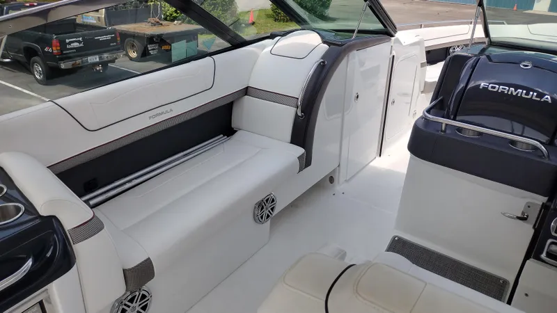 Slide: The Image of 2020 Formula 350 CBR boat interior with white seating and sleek design. - 17