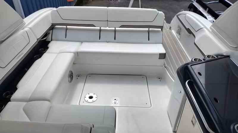 Slide: The Image of 2020 Formula 350 CBR boat interior with white seating and cup holders. - 19