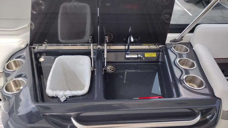 Slide: The Image of 2020 Formula 350 CBR boat sink with trash bin and cup holders. - 22