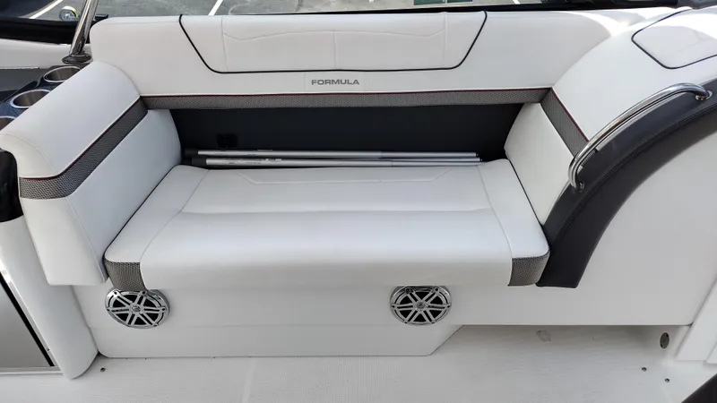 Slide: The Image of 2020 Formula 350 CBR boat interior with white seating and built-in speakers. - 24