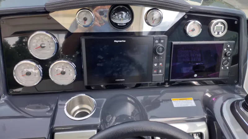 Slide: The Image of Dashboard of a 2020 Formula 350 CBR boat with gauges and navigation screens. - 25