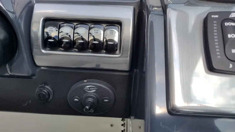 Slide: The Image of Control panel of a 2020 Formula 350 CBR boat with switches and dials. - 27