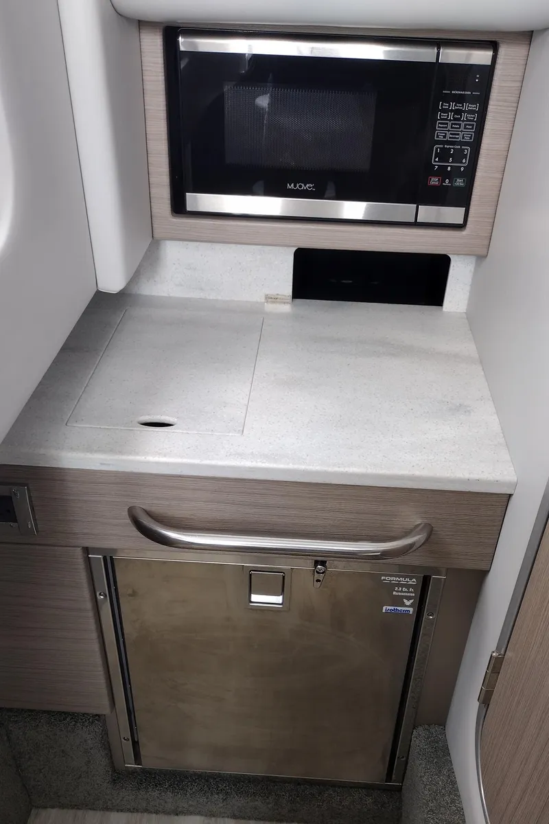 Slide: The Image of 2020 Formula 350 CBR boat kitchenette with microwave and storage. - 33