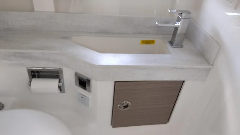 Slide: The Image of 2020 Formula 350 CBR bathroom sink with modern faucet and storage cabinet. - 36
