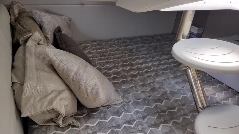 Slide: The Image of 2020 Formula 350 CBR cabin interior with patterned bedding and pillows. - 39