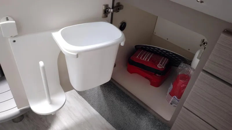 Slide: The Image of Interior storage of 2020 Formula 350 CBR boat with trash bin and supplies. - 42