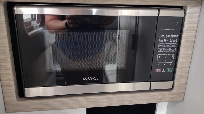 Slide: The Image of Built-in microwave oven with digital controls in a modern kitchen setting. - 43