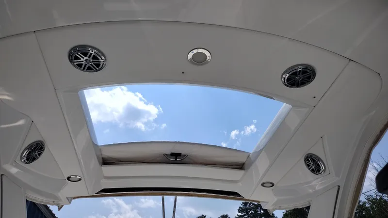 Slide: The Image of 2020 Formula 350 CBR boat interior with skylight and speakers, view of blue sky. - 47
