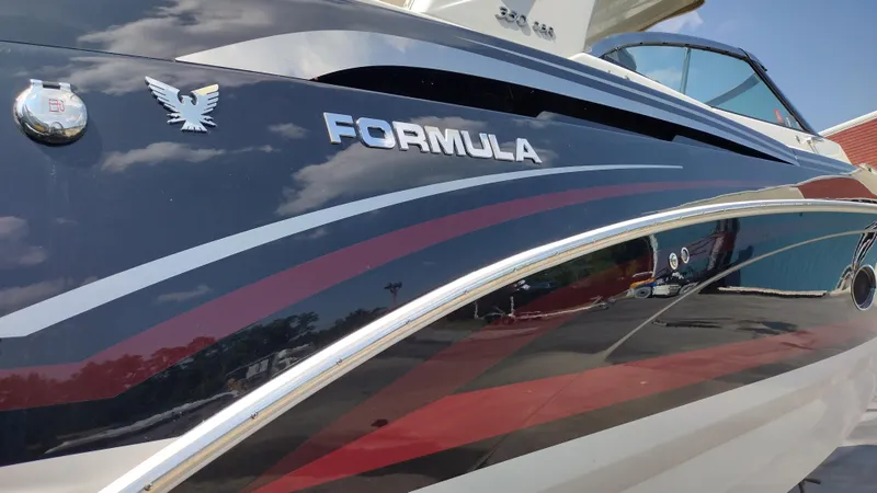 Slide: The Image of 2020 Formula 350 CBR boat with sleek design and logo under a clear sky. - 5